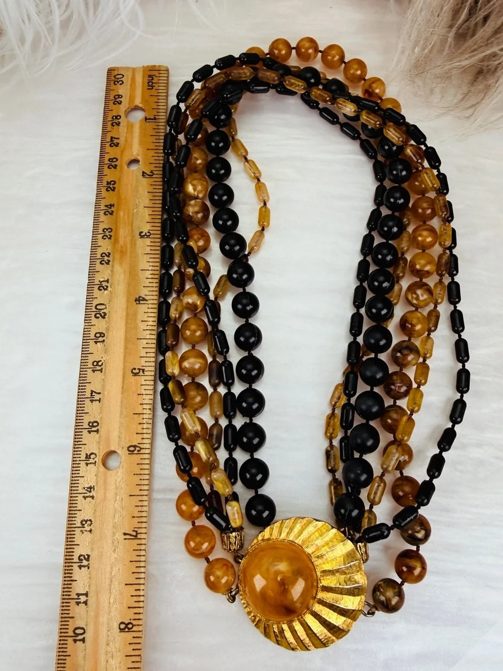 Vintage Multi Strand Black Amber Tone Bead Necklace Gold Tone Centerpiece